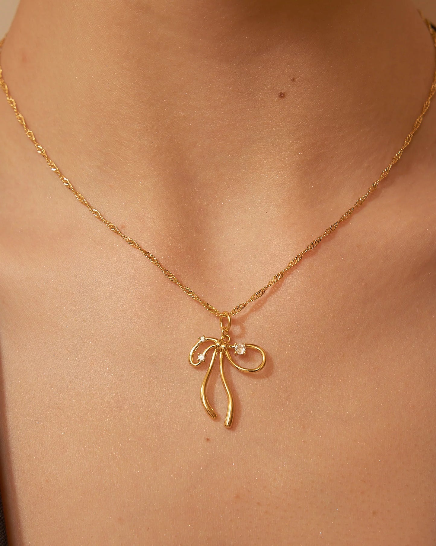 Collana con fiocco oro